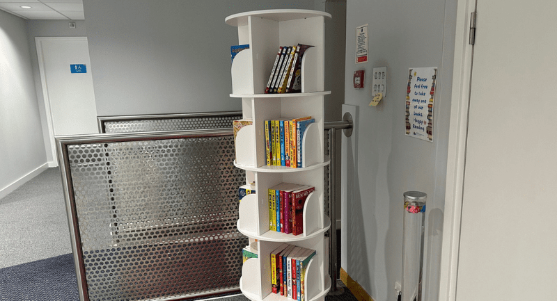 Tall white bookcase in the Aberdeen waiting room